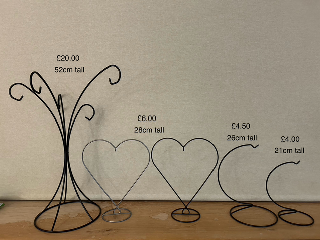 Sienna glass stands available in black silver and gold.