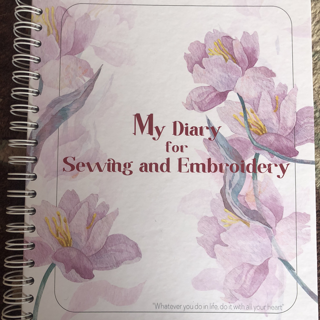 A full set of 447 skeins of CXC threads, and an embroidery planner diary.