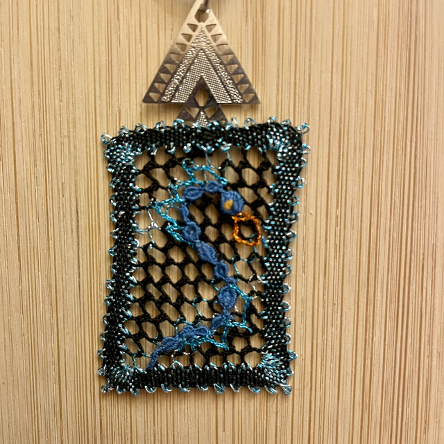 Pendentif résille dragon