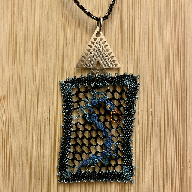 Pendentif résille dragon