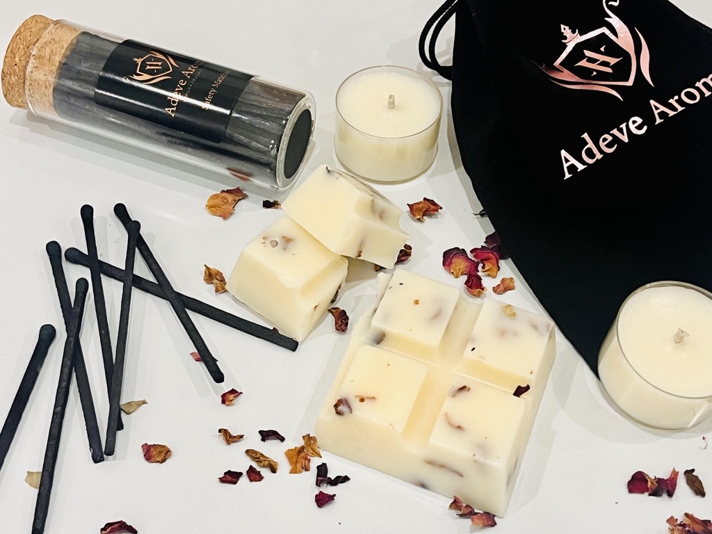 Luxury wax melts infused with dried roses, glass bottle of matches and tea lights in a velvet bag gift set