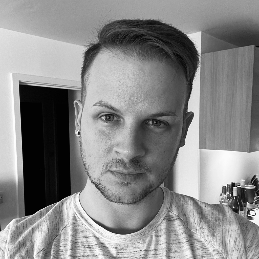 A black and white image of Ricky Smith, an self-published fantasy author.