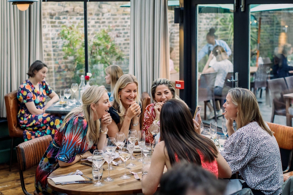 A few friends having a great night out at a wine tasting event