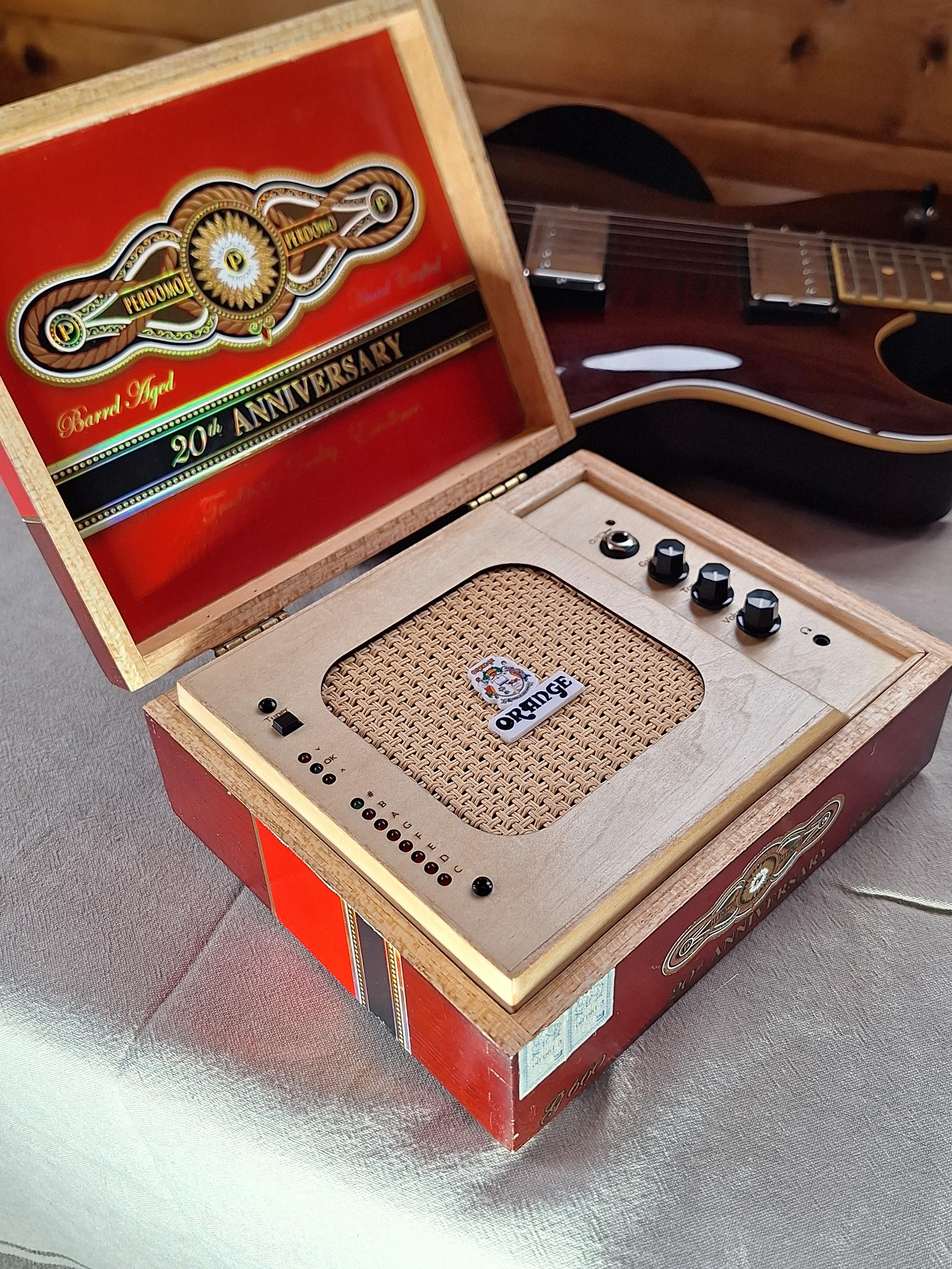 A red Perdomo 20th Anniversary BoxAmps amplifier