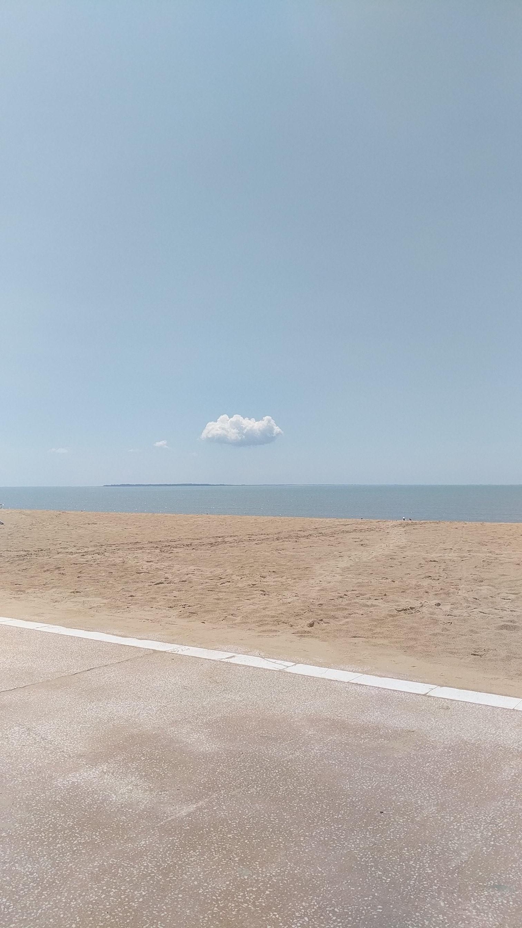 Lone floating cloud over the sea  -Aytré, France. 