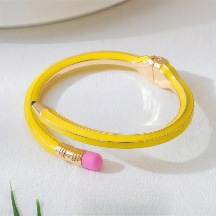 Quirky yellow pencil bracelet in metal and enamel