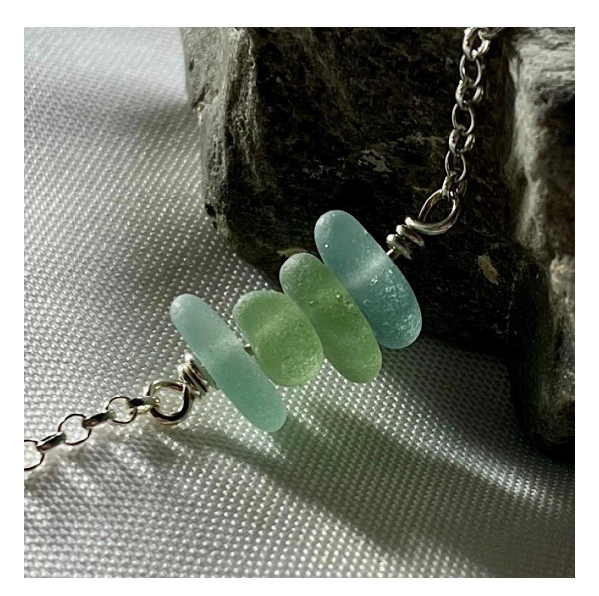 Handmade sterling silver sea glass necklace by Silverre featuring genuine sea glass collected along the Kent coastline.