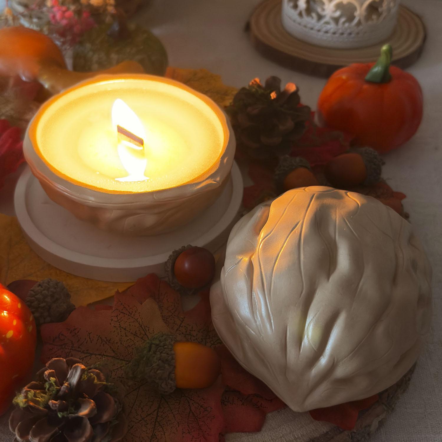 Imagen de una vela en forma de nuez. colección de otoño/invierno. fragancia francesa de lujo.