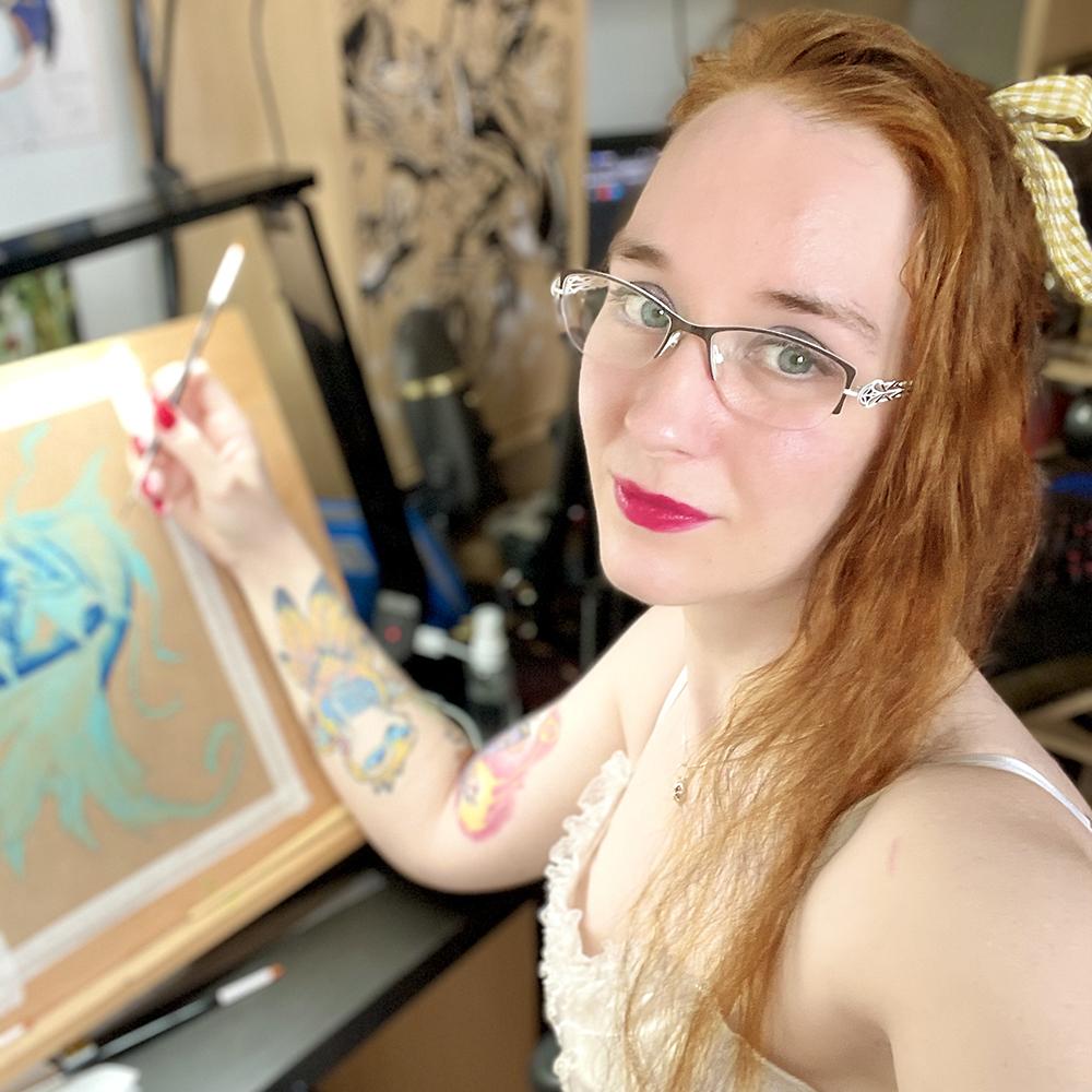 Photo de l'artiste dessinant à l'aquarelle.