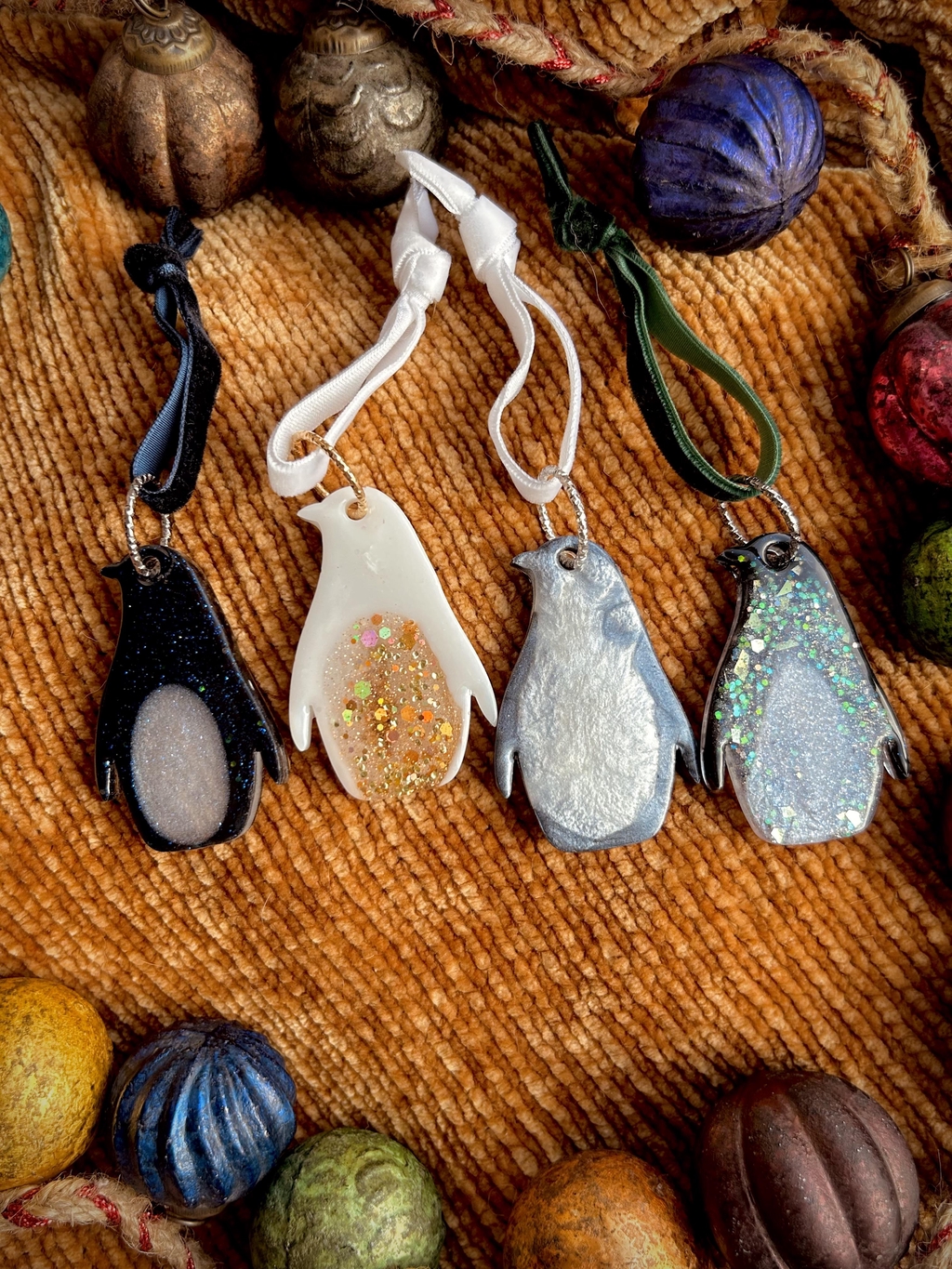 Photo is of a pair of resin penguins