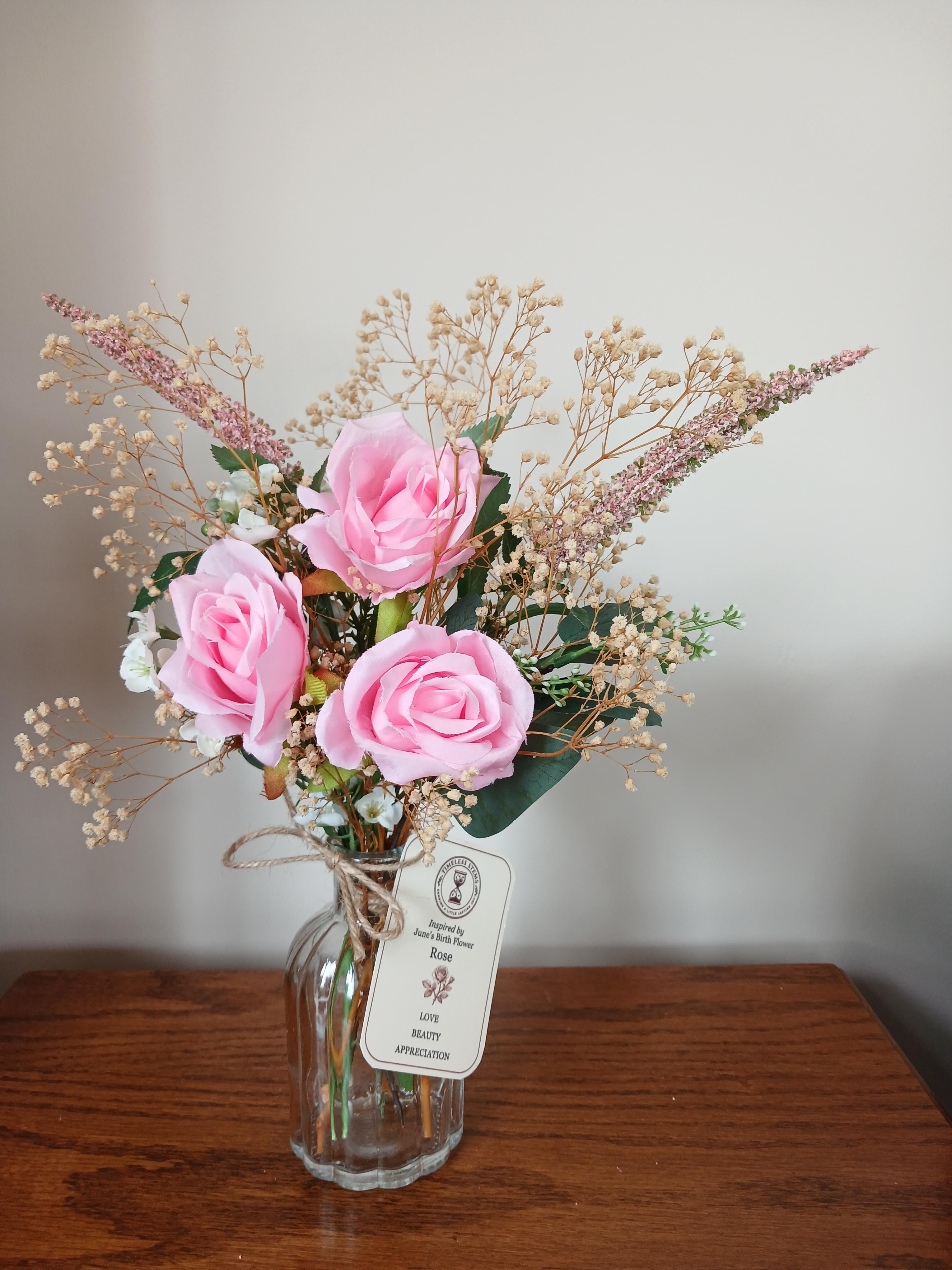 June birth flower posy inspired by roses, blending blush faux petals and dried textures. A beautiful keepsake gift.