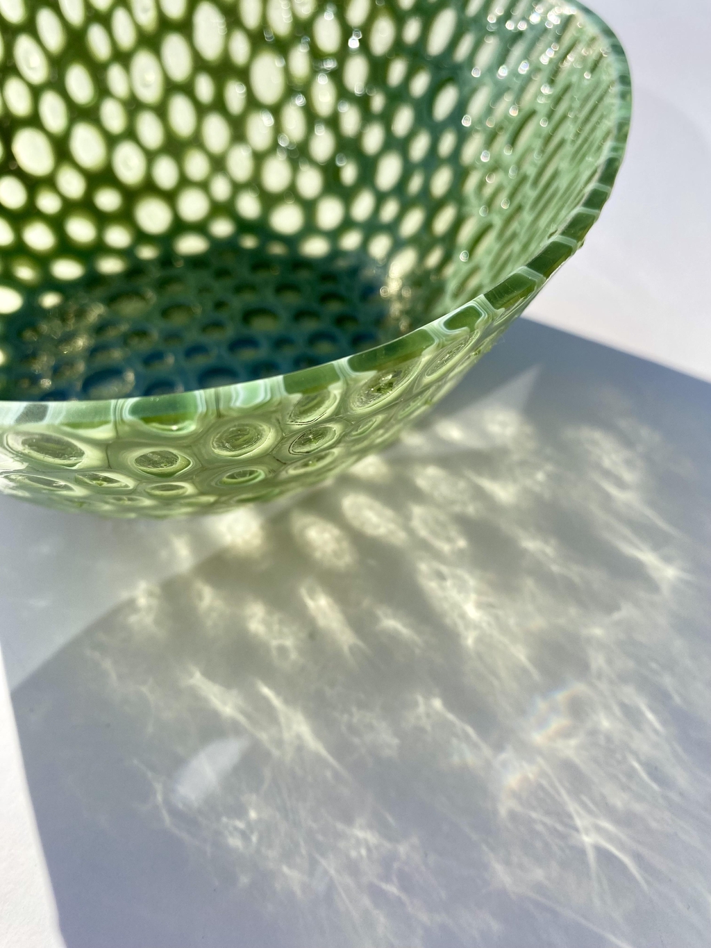 Green glass bowl made of individual round murrine 