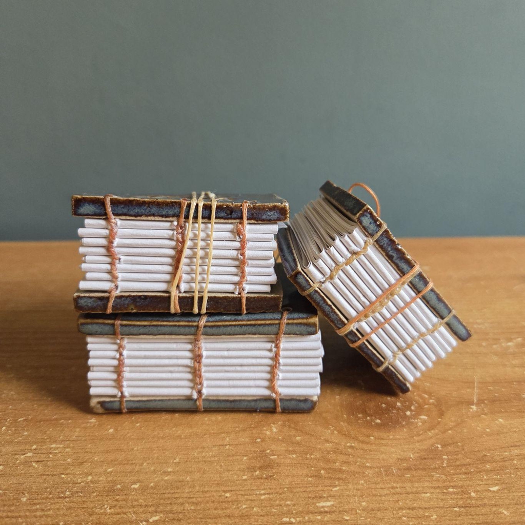 Book binding using Coptic stitch and hardback ceramic tiles