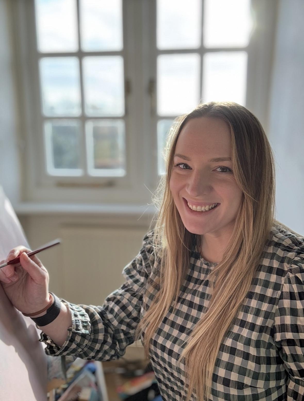 Photo of artist Steph Cork at her studio in Deal, Kent