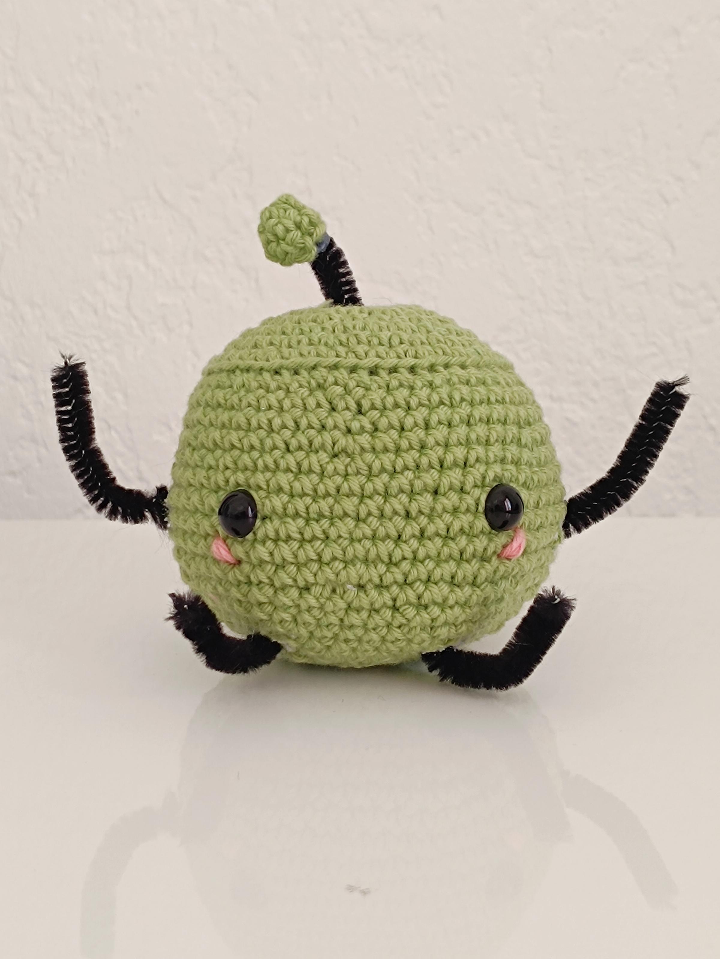 Un Junimo de Stardew valley, vert, réalisé en crochet.
