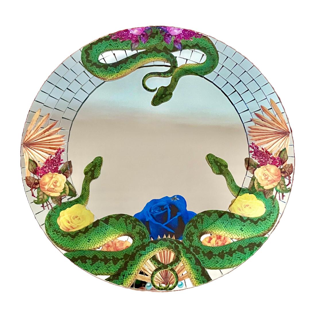 Tropical Punk 2 mirror by Luciano Rocha, featuring a collage of snakes, tropical flowers, and dried palm leaves, blending boldness and elegance in sustainable art.