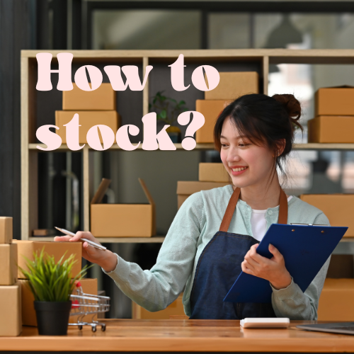 A photo of a woman counting boxes of inventory.