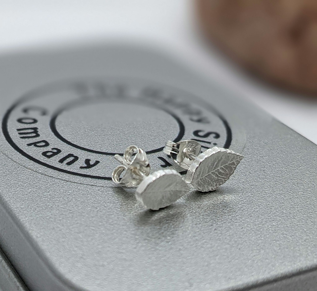 Medium-sized handmade silver earrings, including pretty flower designs and classic hoops, hand-finished in Nicky's Hampshire workshop.