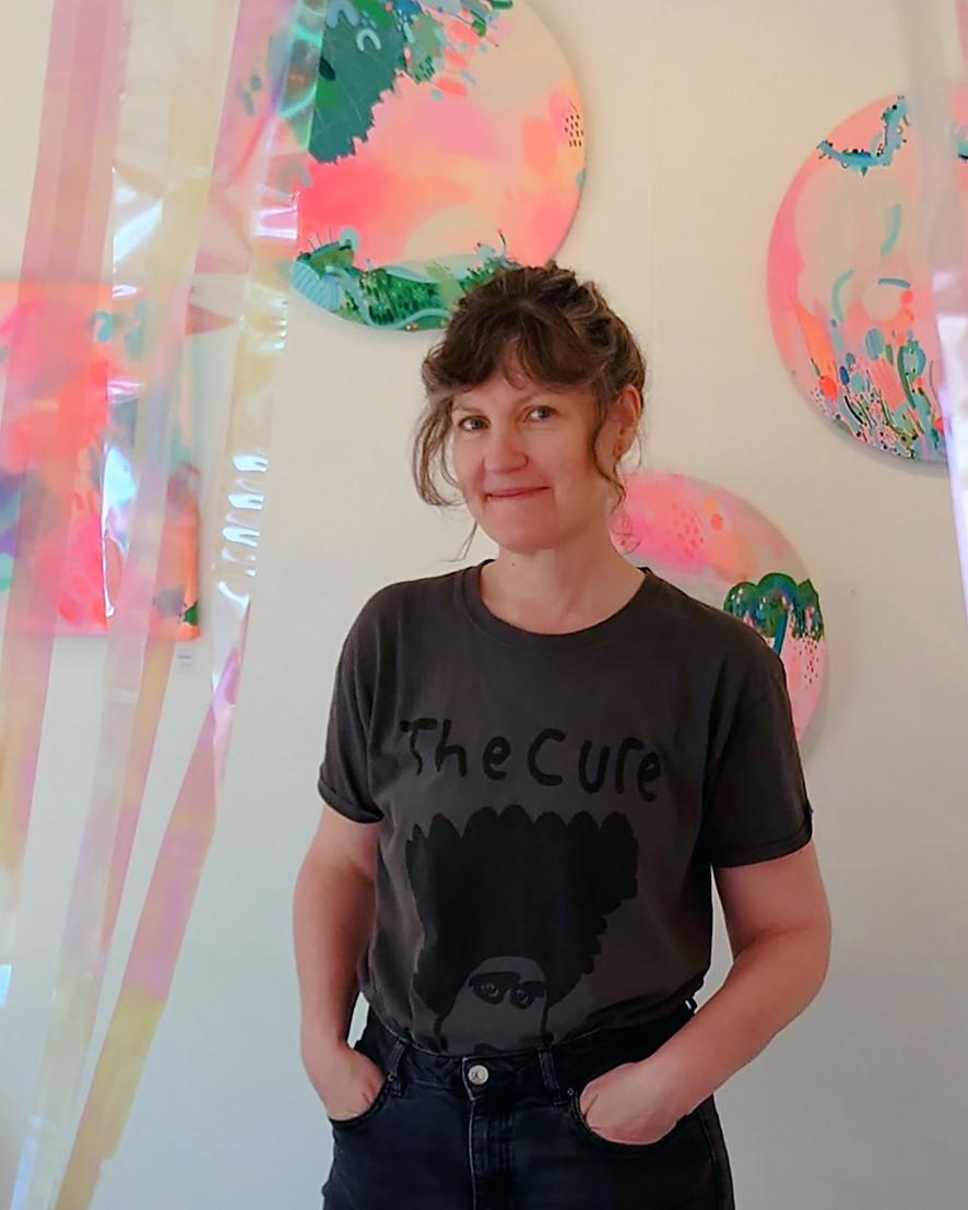 Abstract expressionist artist painting in her studio