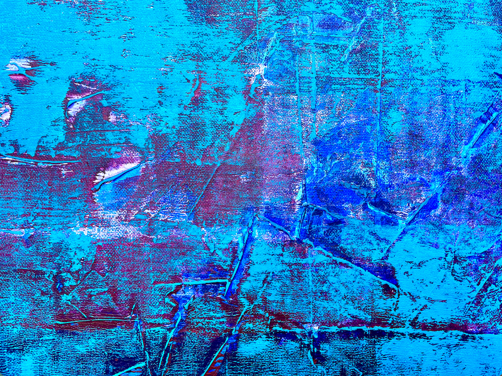 Close-up of a textured blue abstract painting showing detailed palette knife strokes and layers modern canvas art details.