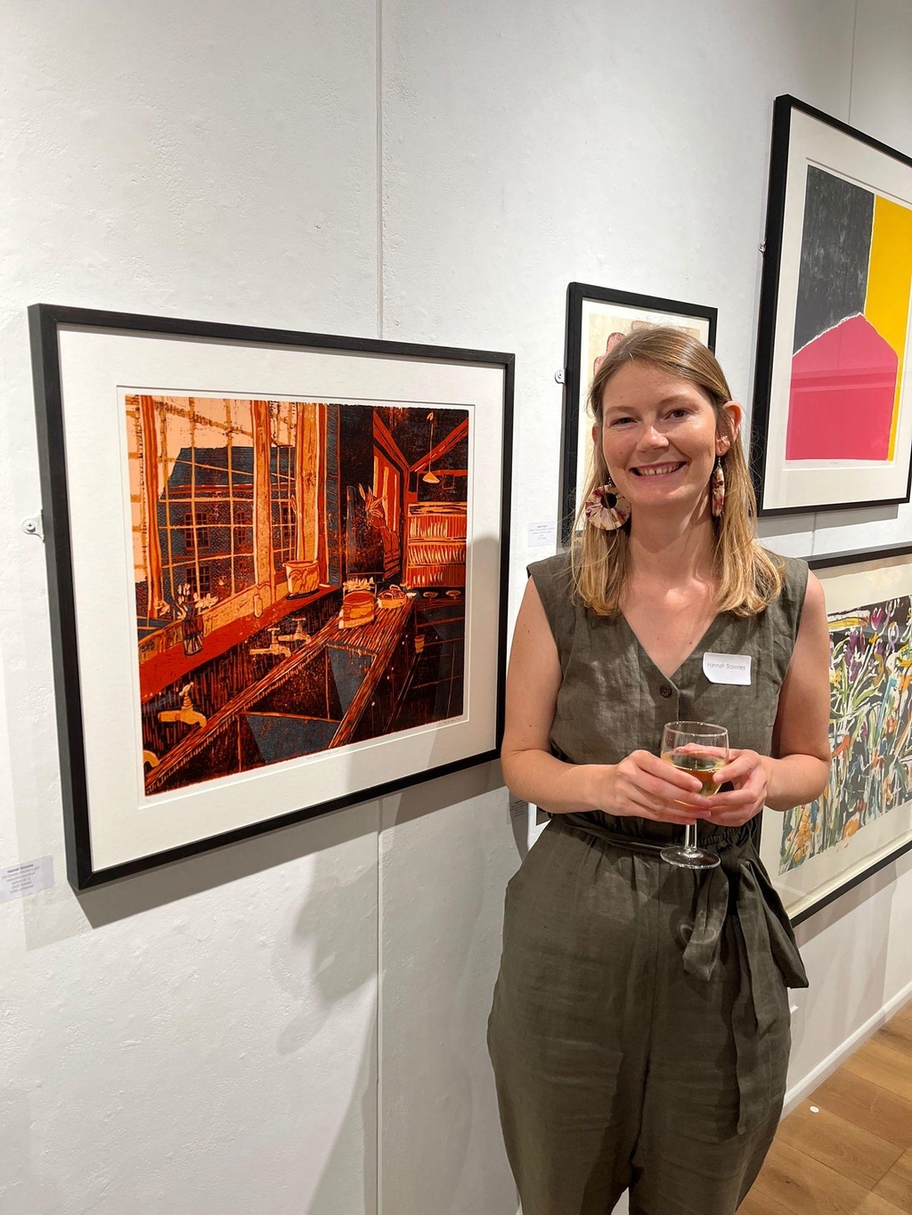Hannah is testing different paint colours out on a glass table