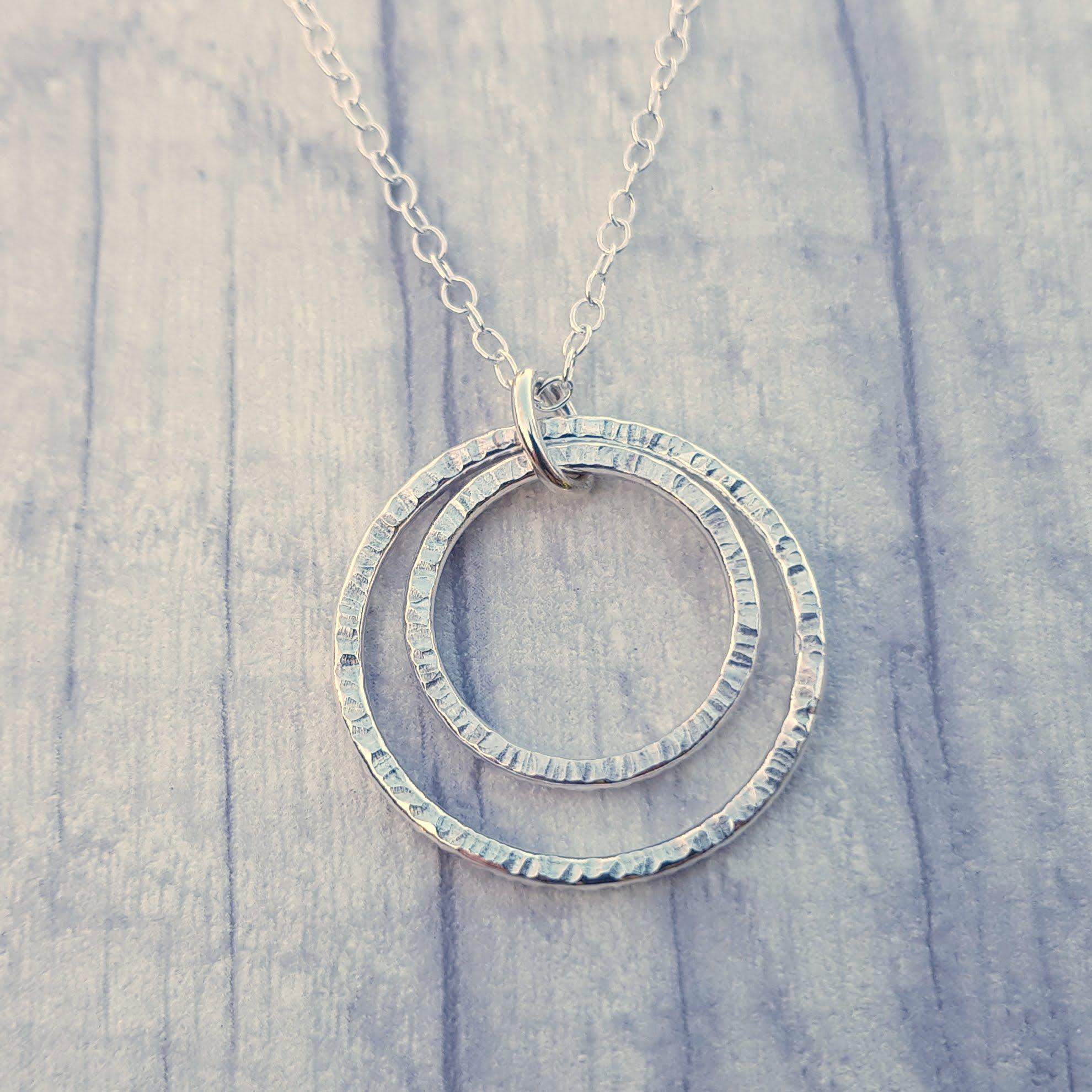 Hammer textured sterling silver hoop pendant