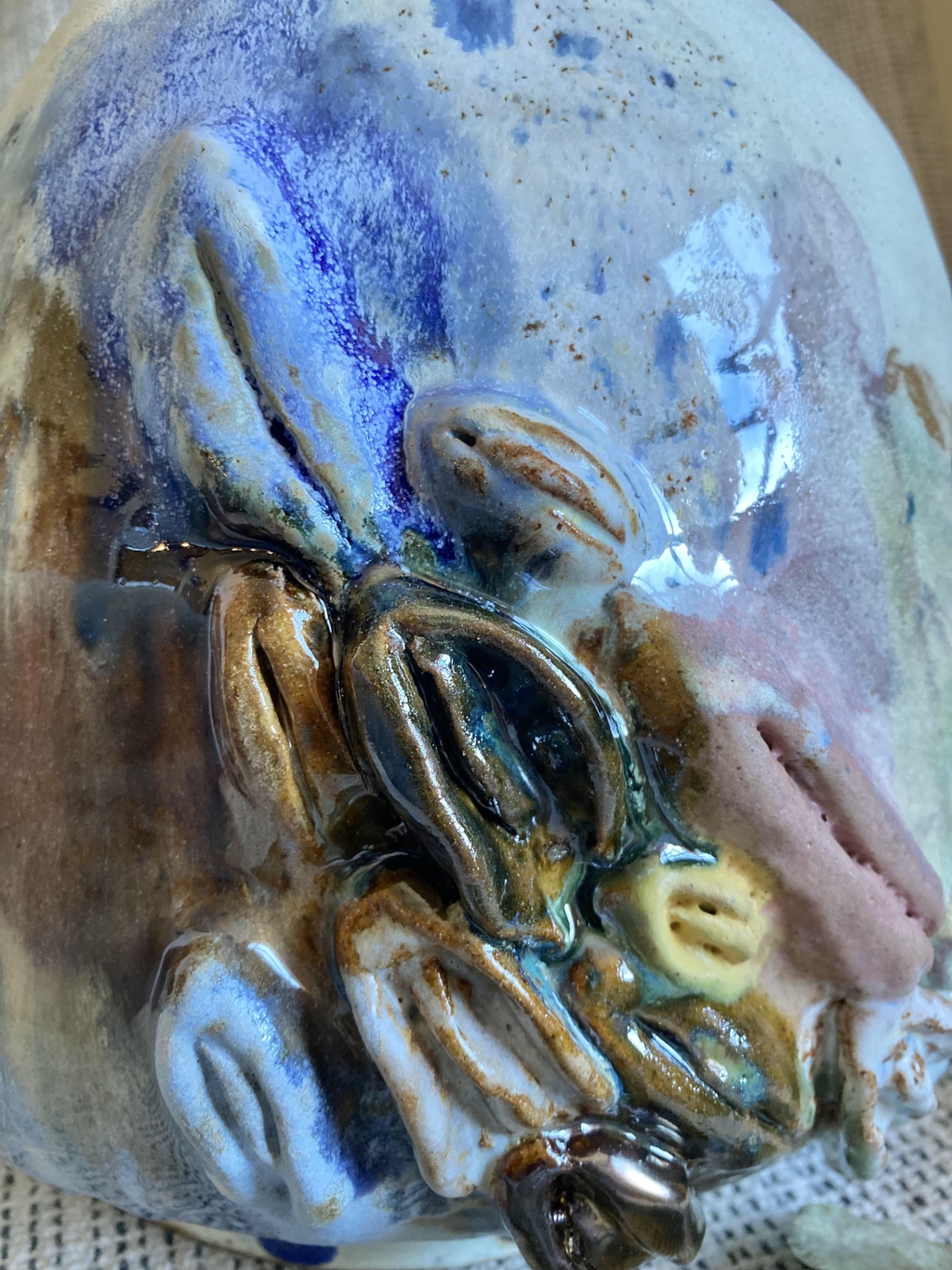 Close up image of the detail on a piece of ceramic art from Charlotte Gower's identity and signalling project