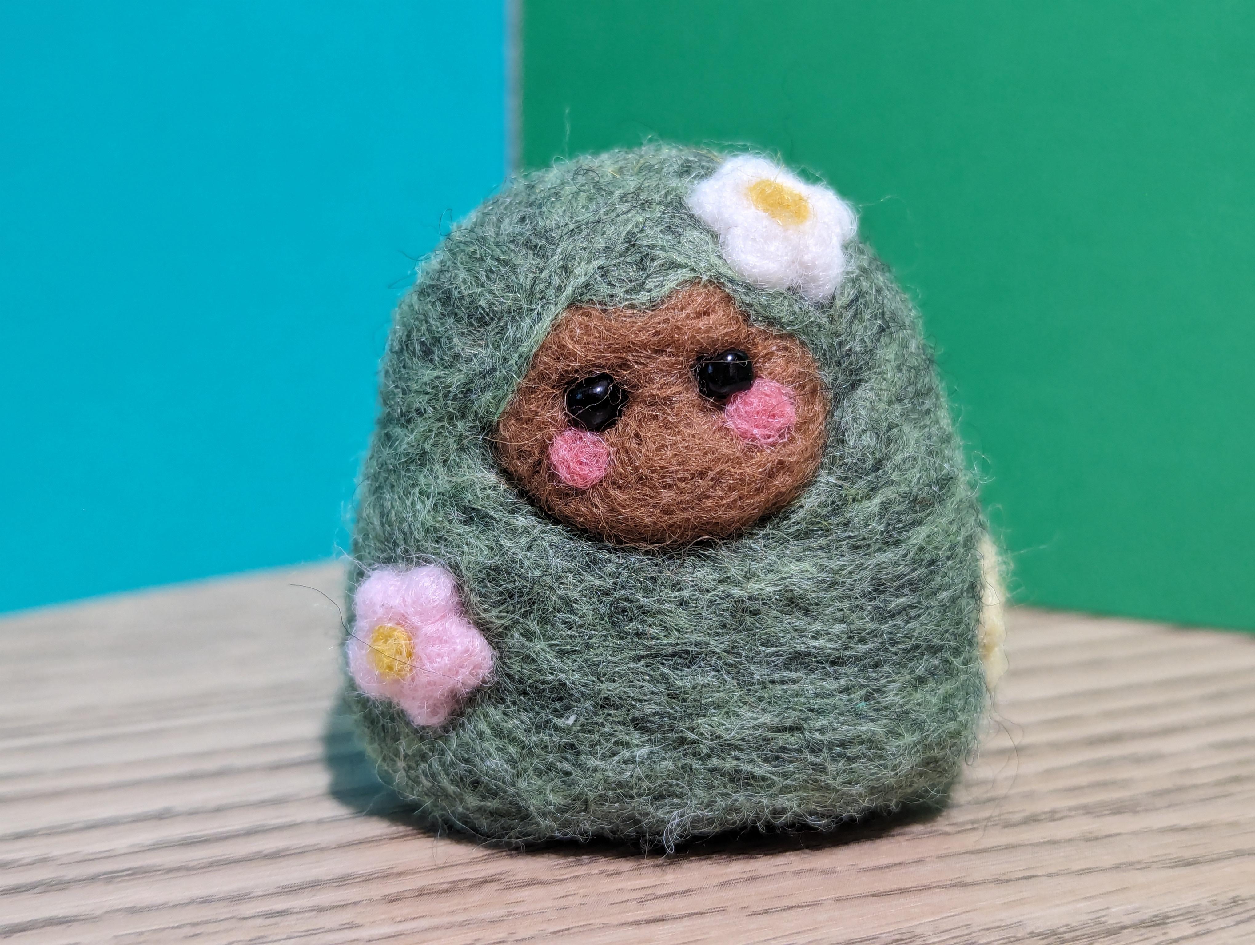 Picture of a needle felted bush fairy.