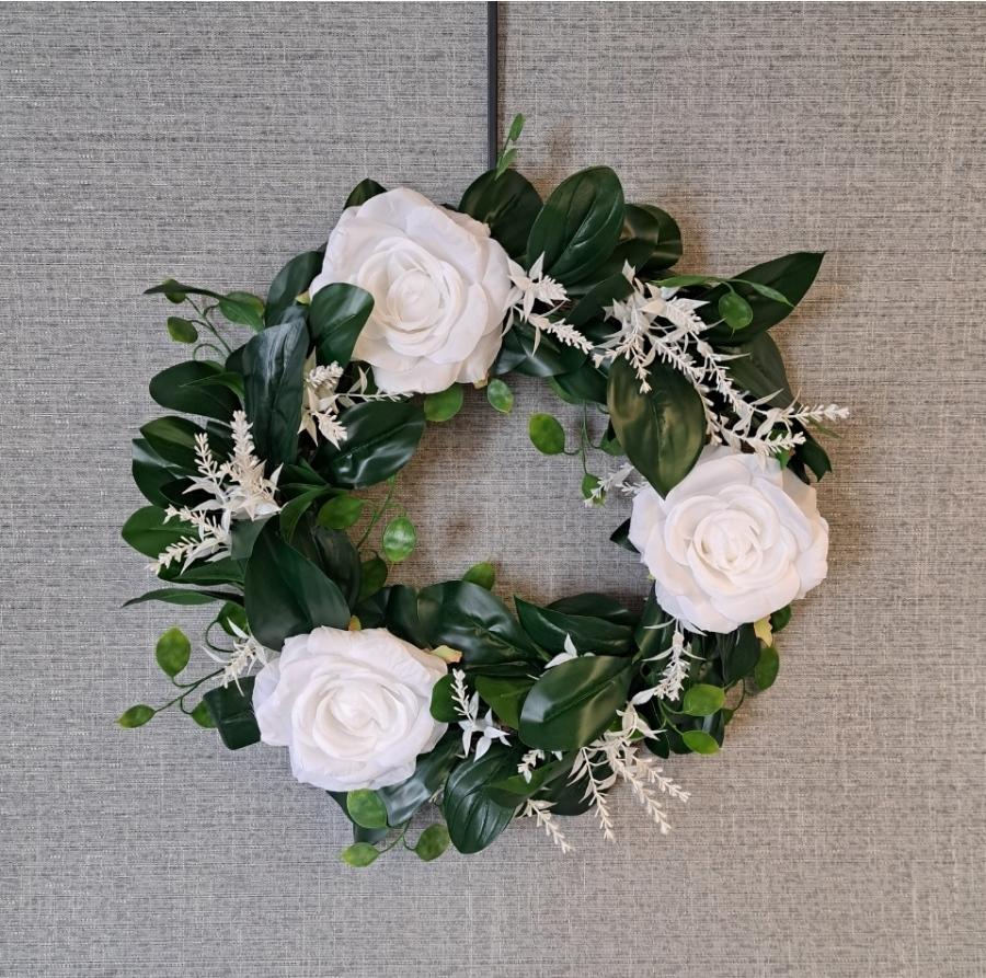 Handcrafted artificial flower wreath with white roses
