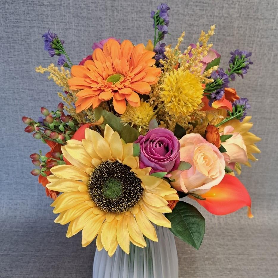 Artificial flower arrangement colourful