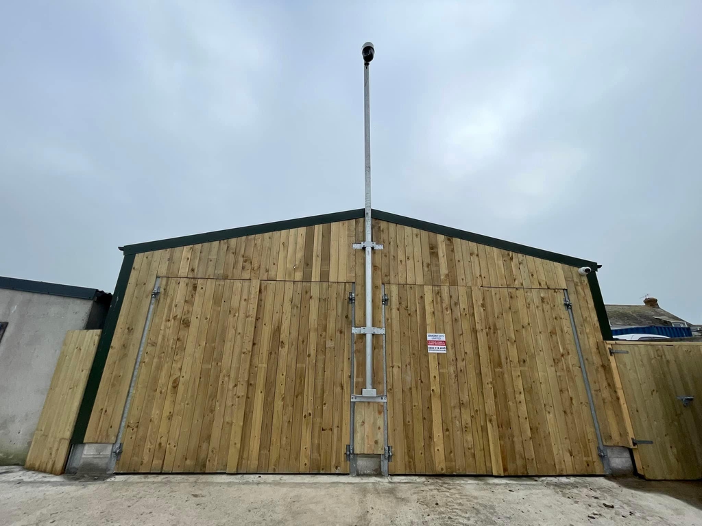 Here is an image of a HikVision Pan Titl and Zoom PTZ camera mounted on a custom made bracket for a car park in Tintagel North Cornwall
