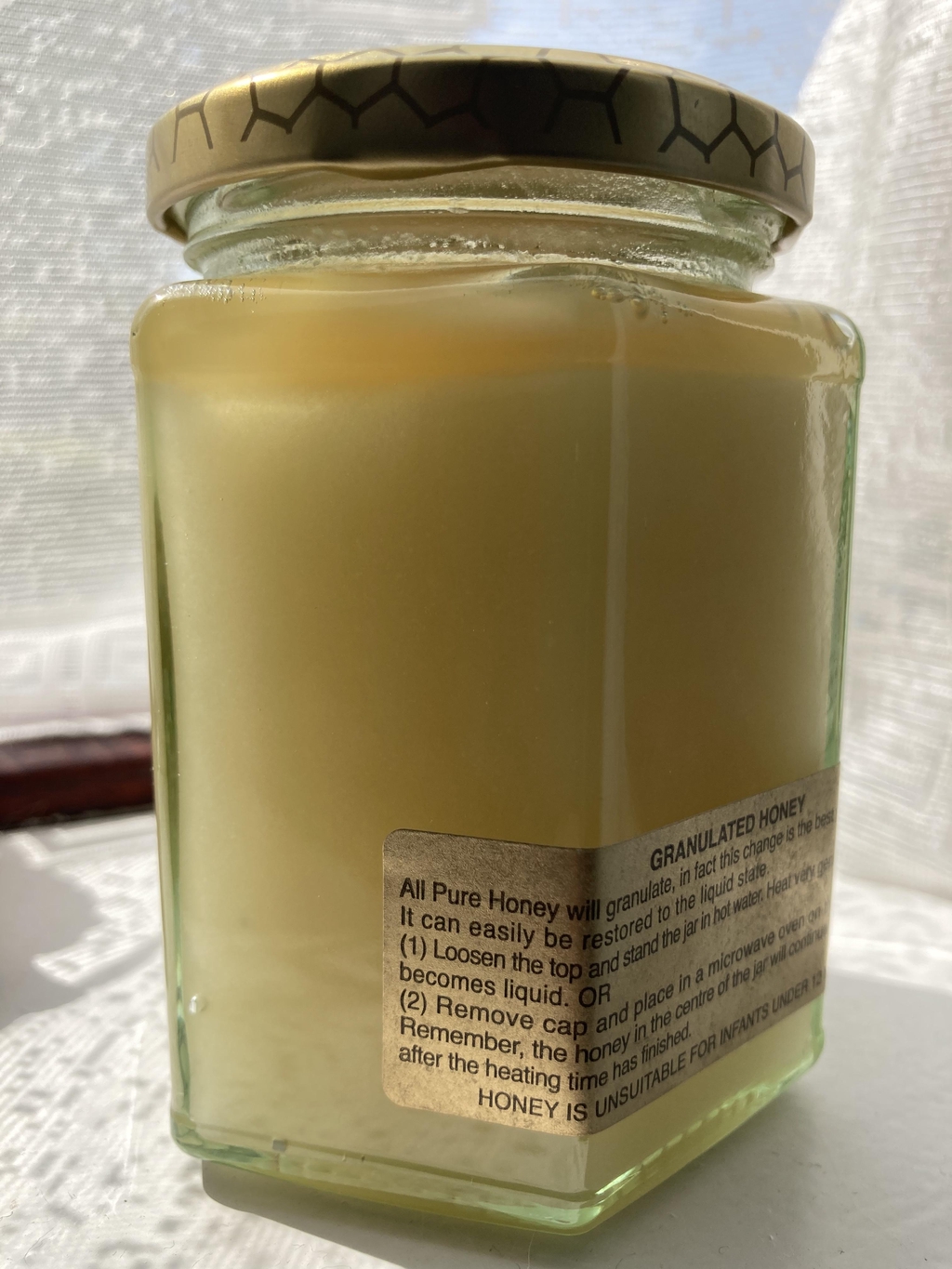 Jar of granulated honey