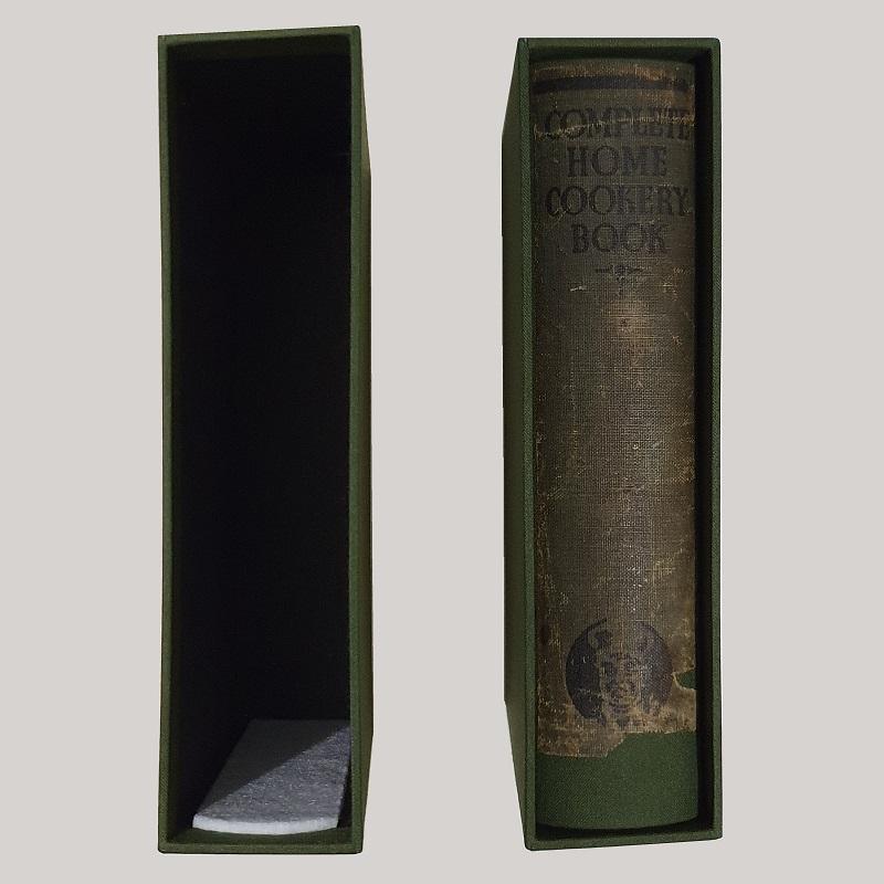 The custom made slip case in matching colour with a felt inlay to support the bock block.