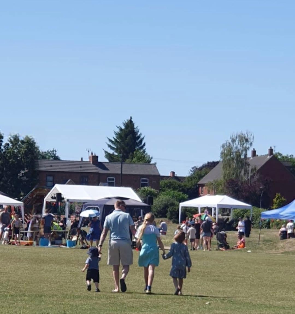 Family walking towards Lawford Summer Festival