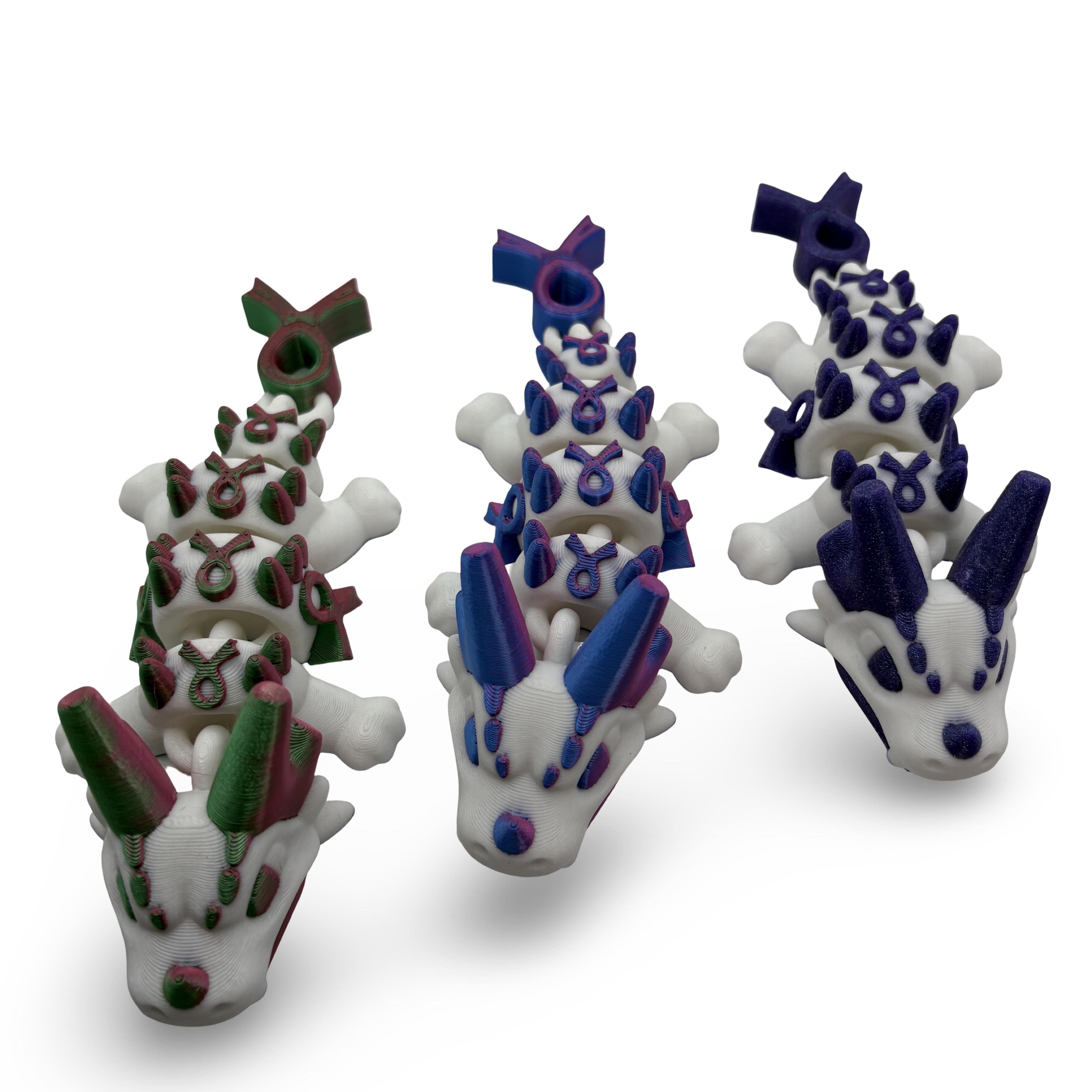 3D-printed Awareness Dragon in green, pink and white supporting S.U.R.E.