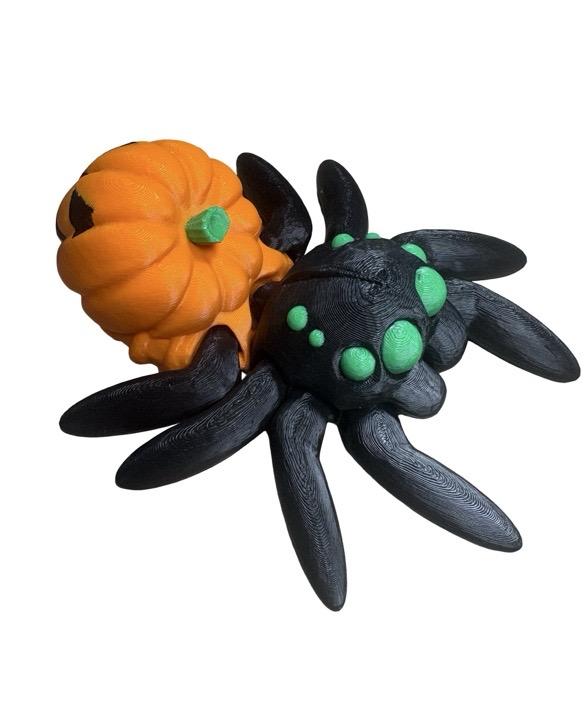 Articulated 3D-printed pumpkin spider with a pumpkin abdomen, perfect for Halloween decorations and Spooky collection.