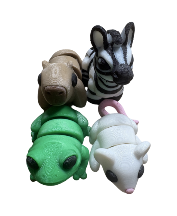 Articulated 3D-printed animal collection featuring a butt frog, mouse, zebra, capybara and many more figures made in the UK.