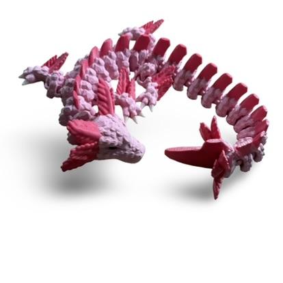 Pink axolotl, 3D-printed, curled up, showing its side