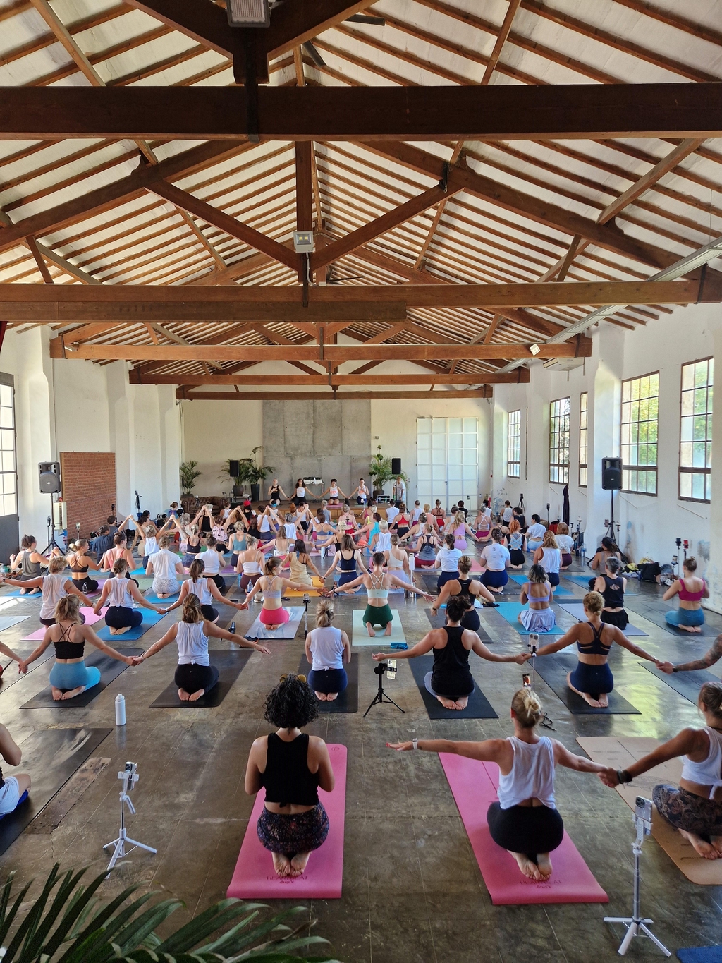 Summit back of the room holding hands