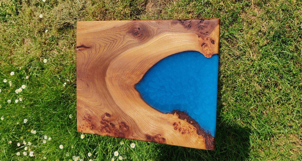 stained burr elm table top with blue resin inlay