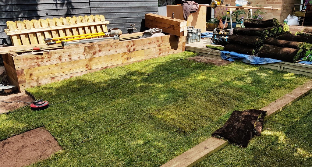 landscaped garden with turf and raised bed