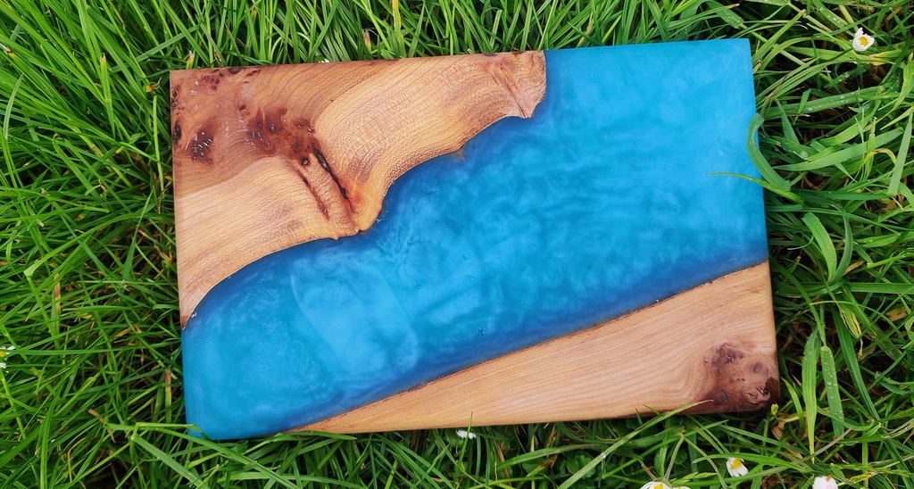 stained burr elm chopping board with blue resin inlay