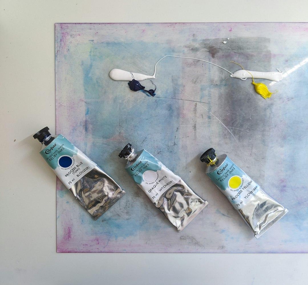Tubes or blue, white and yellow printing inks