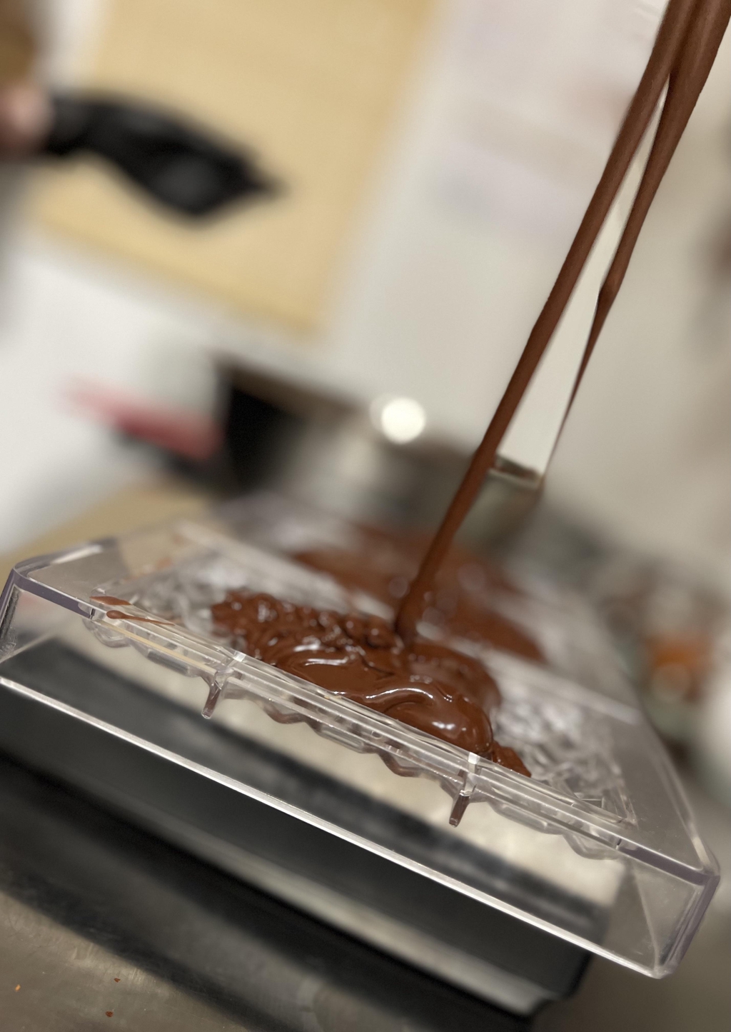 pouring chocolate into the moulds