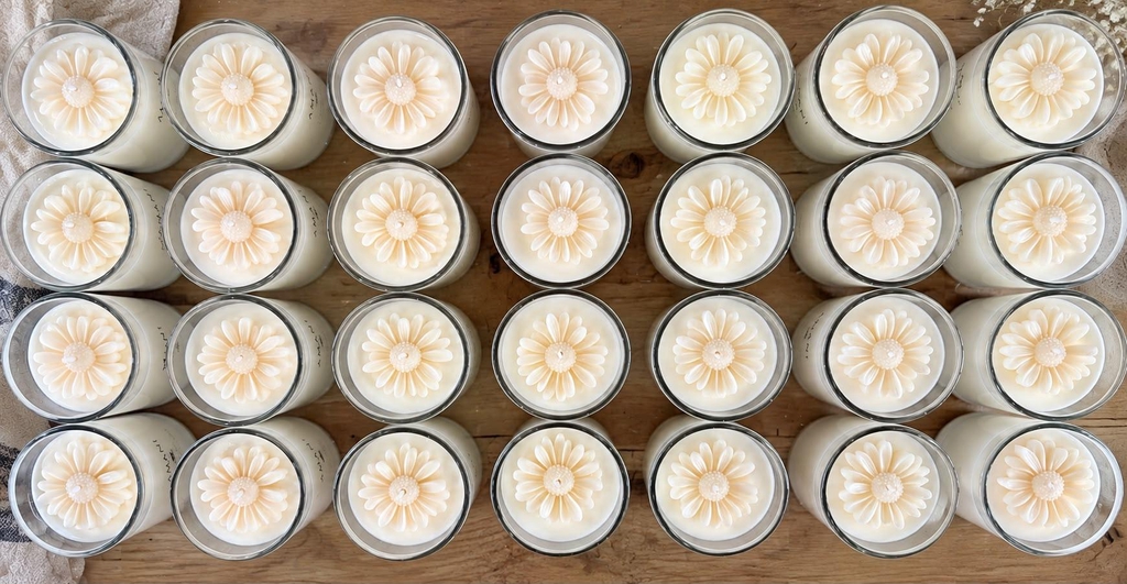 Hand-poured vegan soy wax candles with delicate daisy flower decorations, handmade by Amani Scents in Boston Spa, Wetherby.