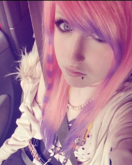 Wig review photo of customer wearing a pastel pink scene wig
