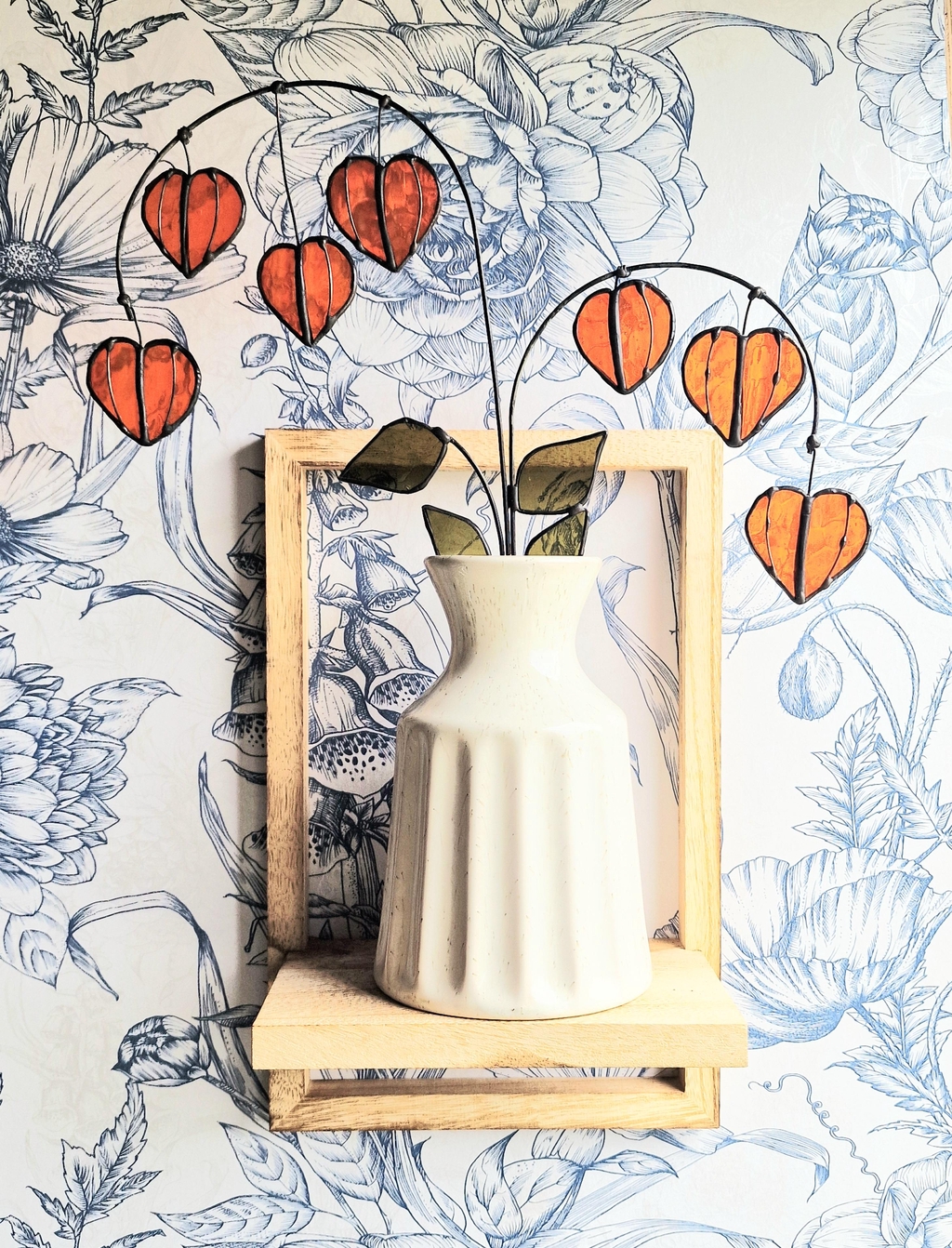 A collection of artisan-made stained glass flowers. Statement home decor and unique gifts 