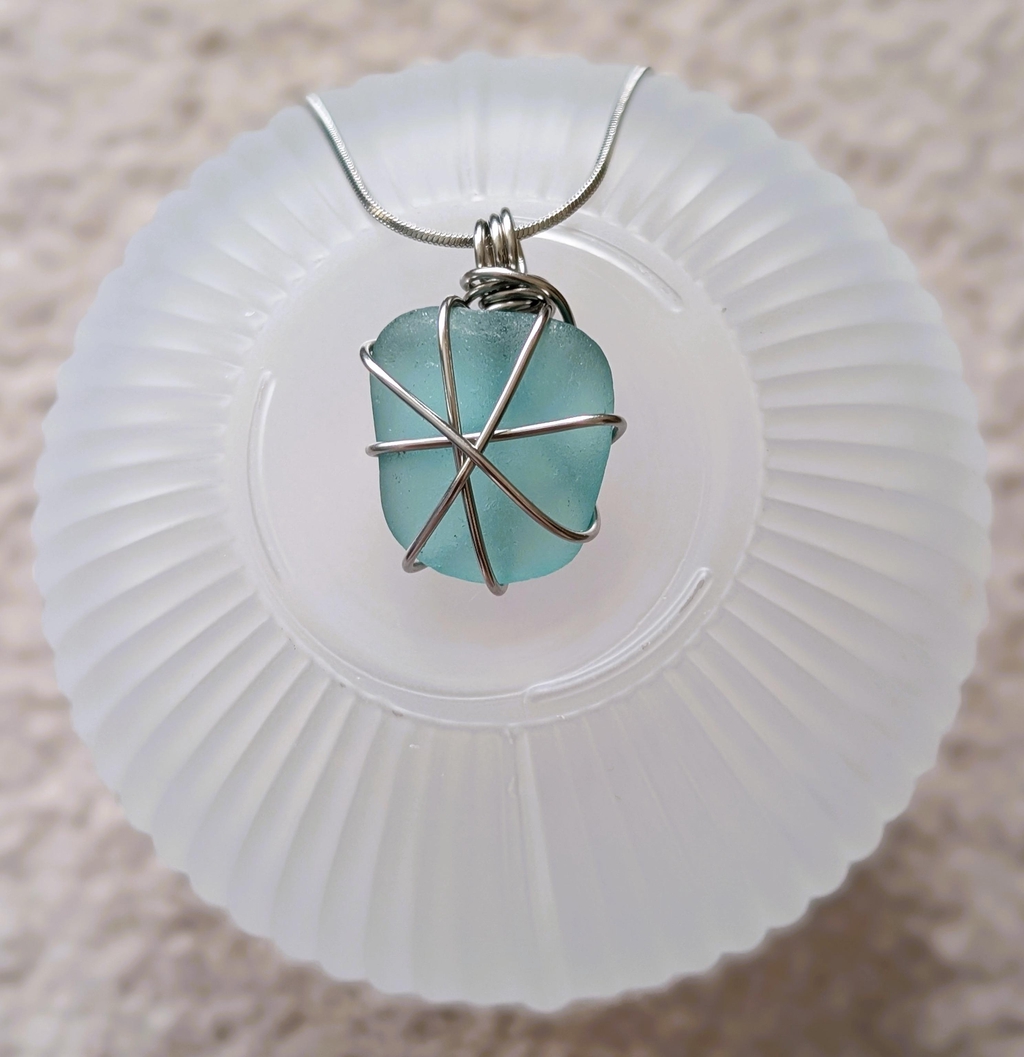 Authentic Cornish white sea glass necklace, hand-wrapped in durable stainless steel wire. Unique jewellery by CornishFinds. Sea glass found on Marazion beach.
