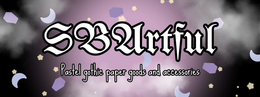 On a dark cloudy background filled with pastel coloured moons, stars and coffins has the phrase SBArtful - pastel gothic paper goods and accessories.