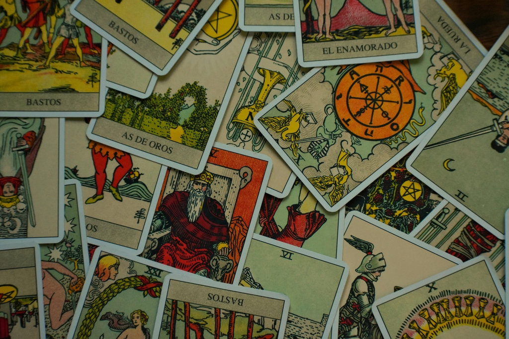 An assortment of Tarot cards with traditional depictions.